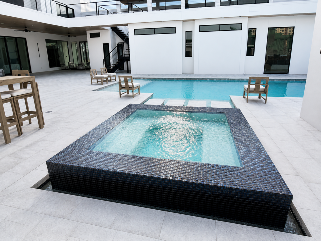 Raised black tile spa and modern custom pool in The Woodlands, Texas